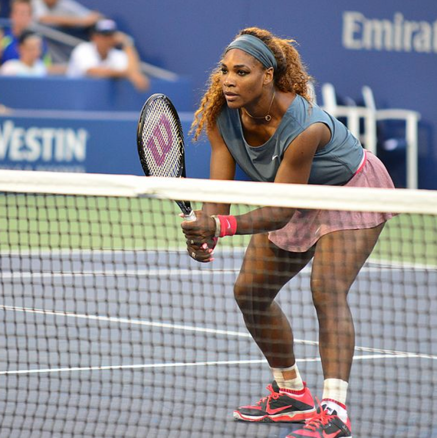 Serena+Williams+in+a+2013+doubles+match+with+Venus+Williams.