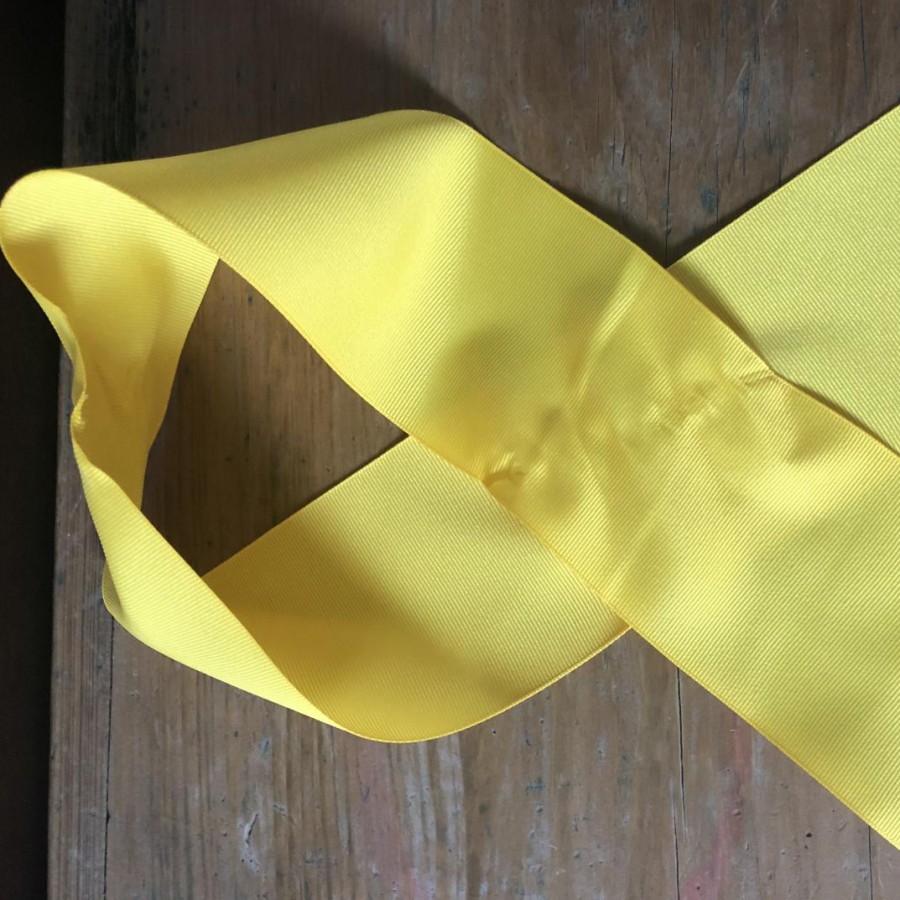 The yellow ribbon, along with many other things, represents suicide prevention.