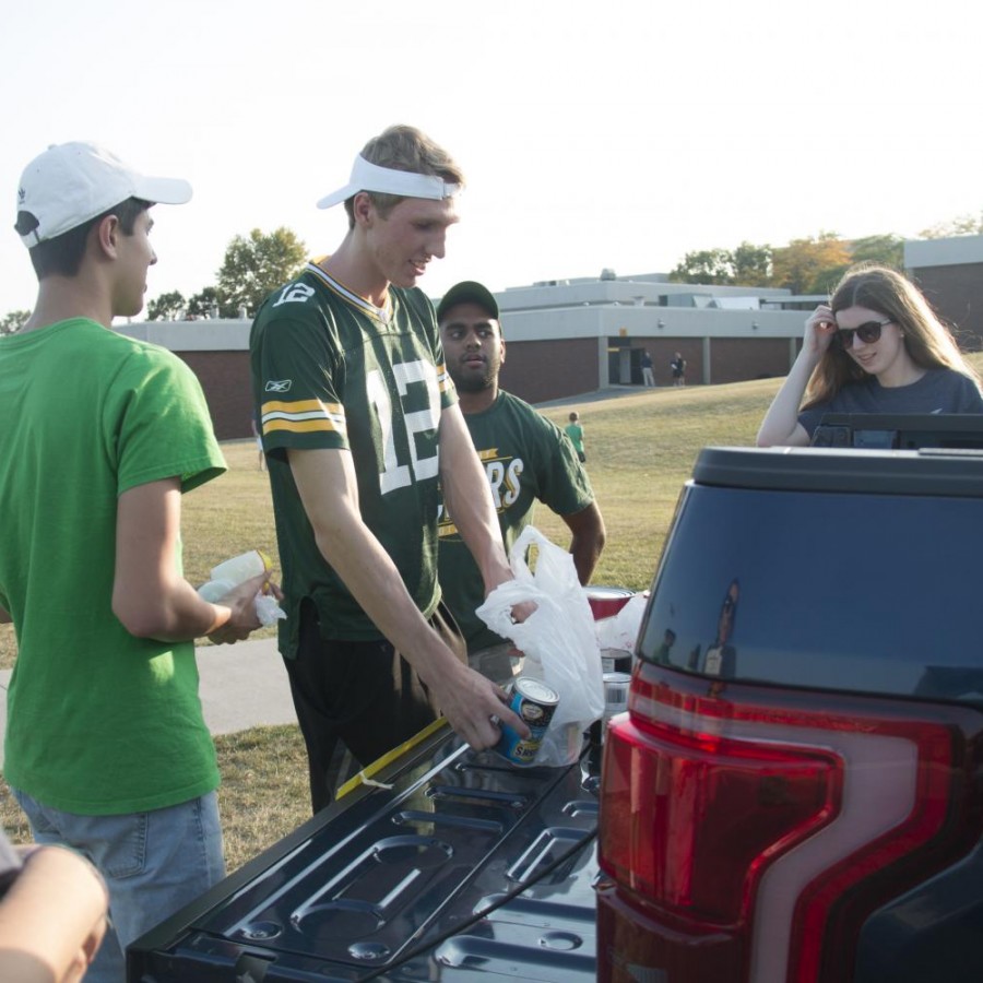 Spartans donating food at the annual fill the truck at the Bettendorf football game.