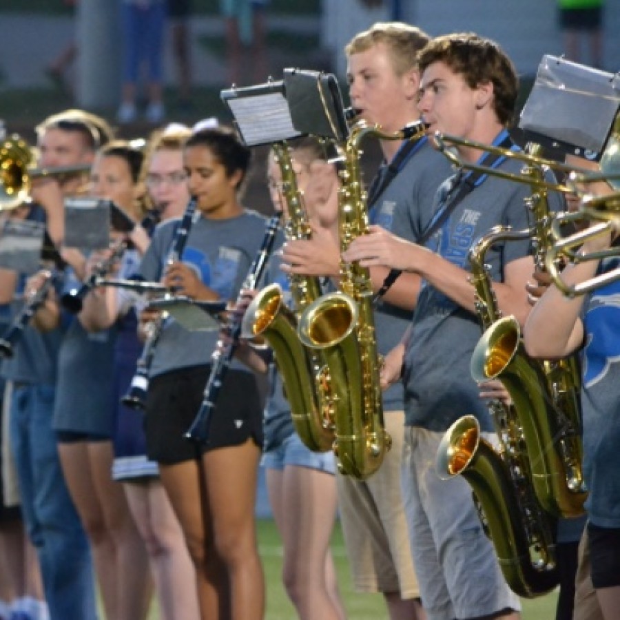 Several members of the Spartan marching band line up  during a Friday night football game. Their performances can be seen during football season under the Spartan Stadium lights
