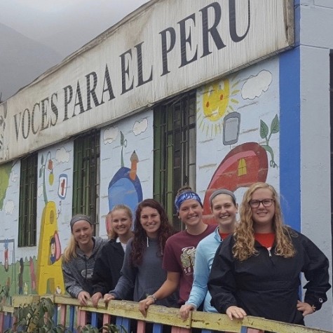 Spartans standing in front of the school, Voices for Peru, created by a PV alumni.