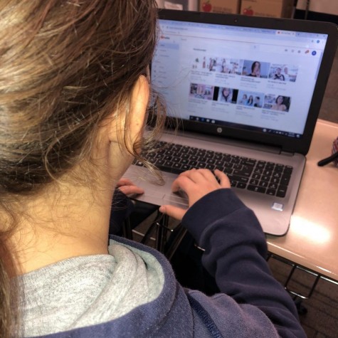 A student shown scrolling on youtube.