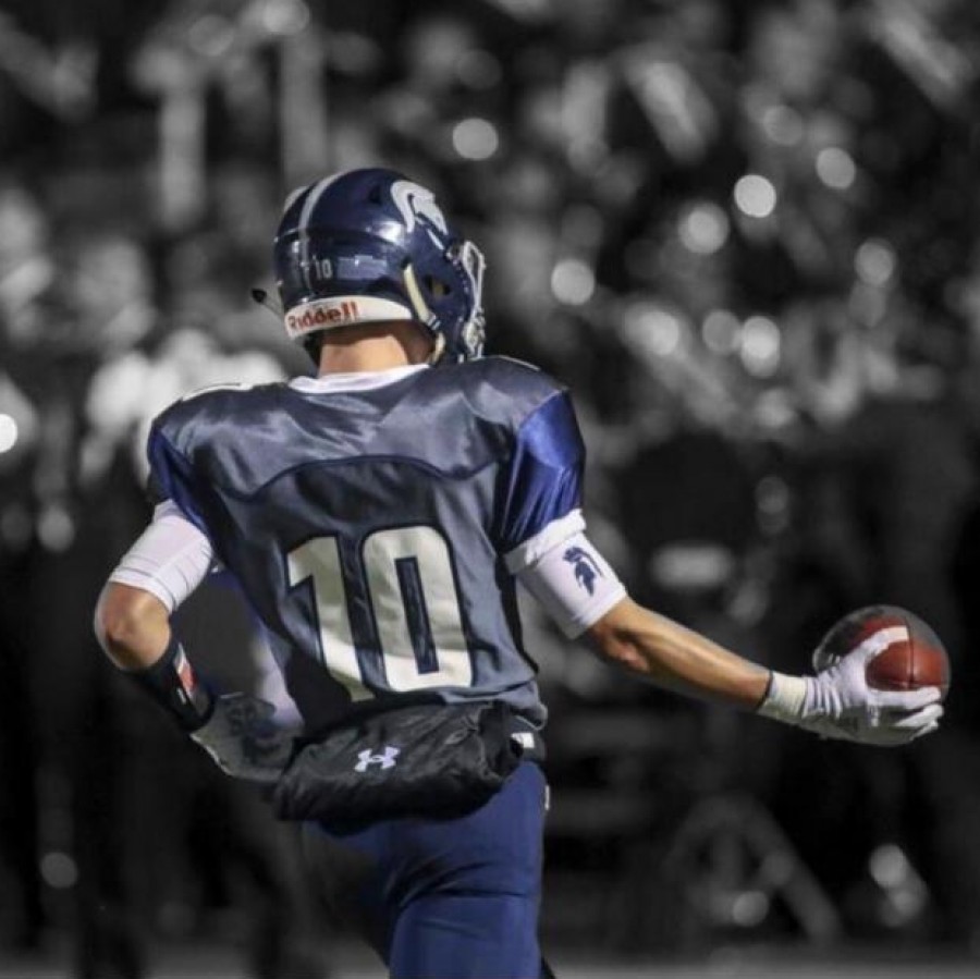 Senior Peyton Lindmark runs onto the field.