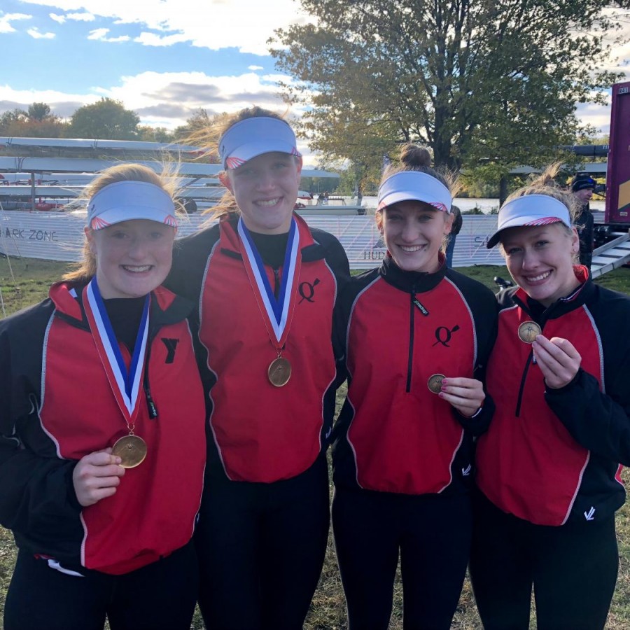 The rowers pose after placing first and second in the Head of the Charles Regatta.