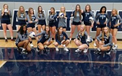 The girls volleyball team poses for a picture