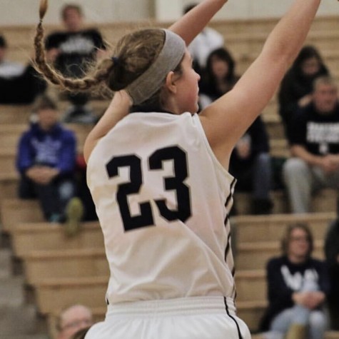 Macy Beinborn shot a three-pointer during a girl’s basketball game in the 2017-2018 season