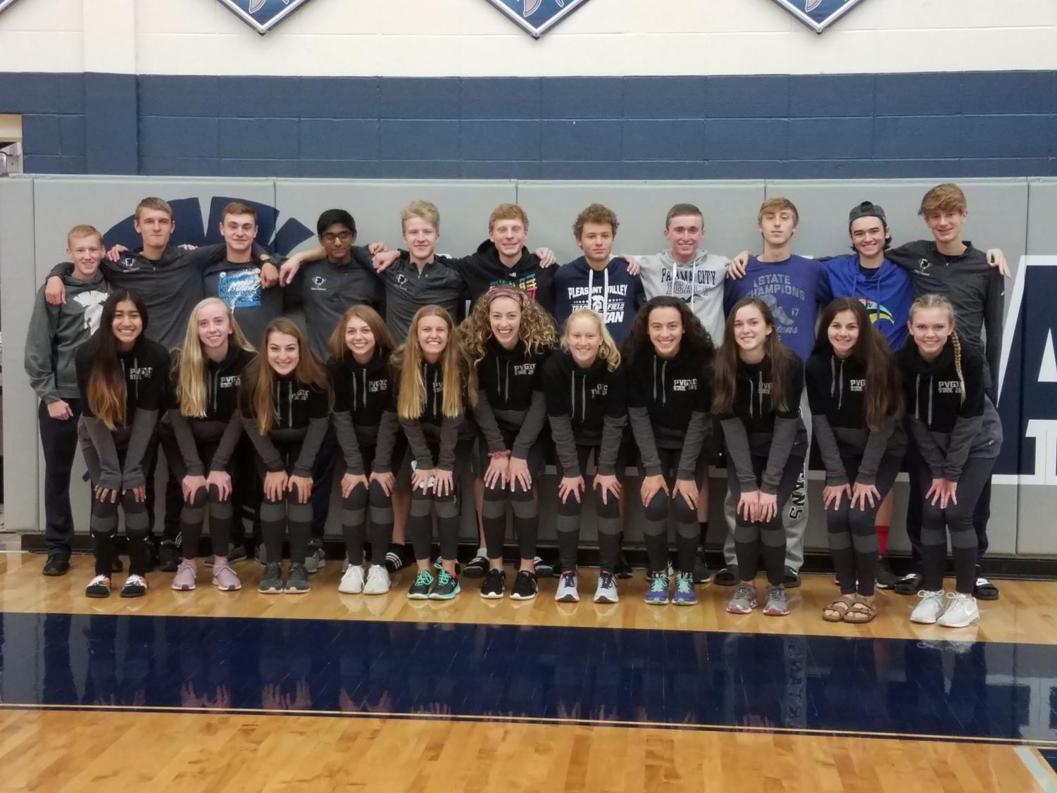 The Cross Country Varsity teams pose together for a picture at their send off before heading off to the state meet.