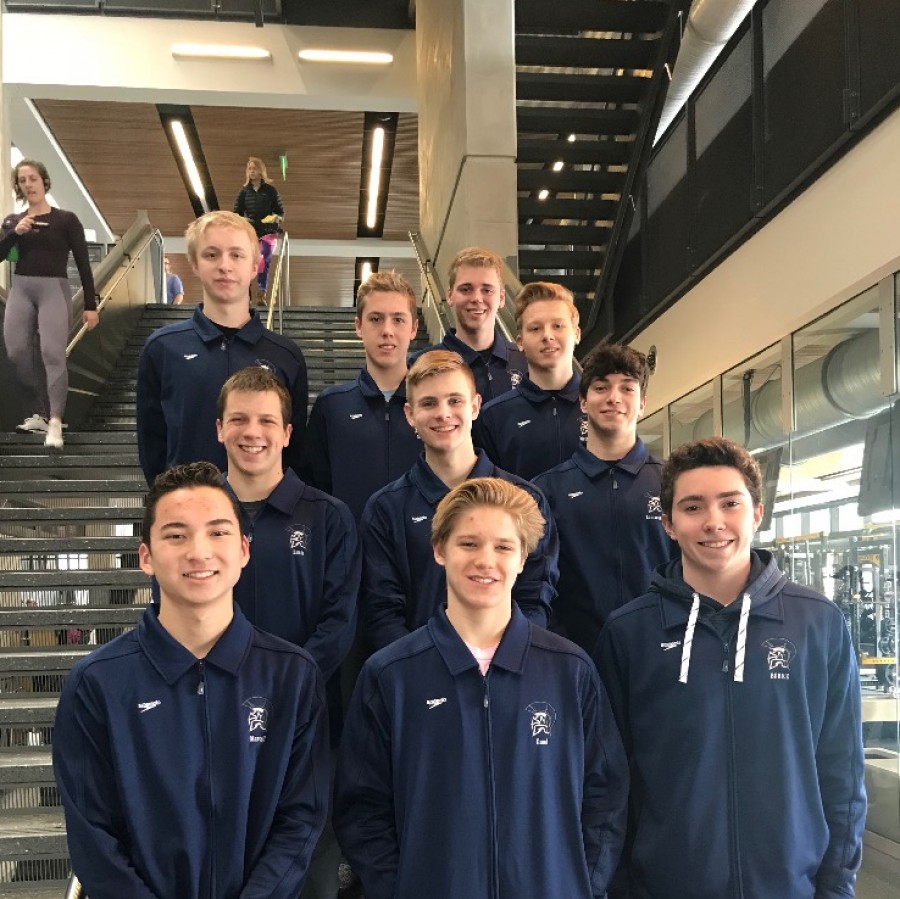 The boys varsity swim team poses for a picture after their state championship meet in Iowa City (Clark is 
in the second row in the center)