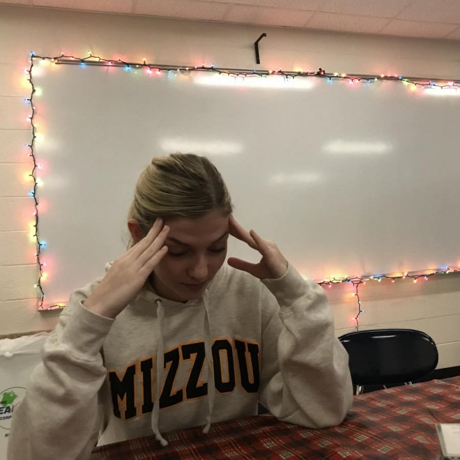Senior Lily Williams gazes down with stress after being prodded with questions about her future over the holidays.
