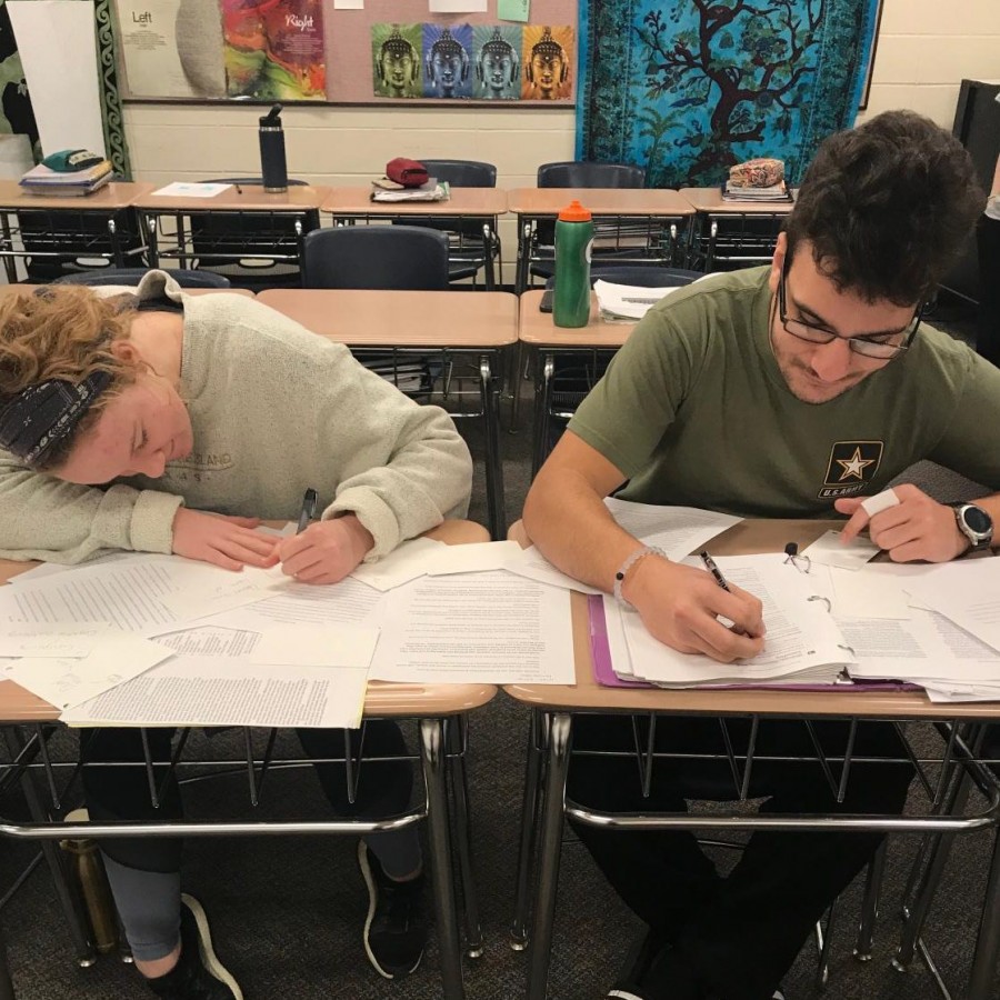 Gui Pinho and Libby Staver, seniors, working on homework for their dual credit psychology class.
