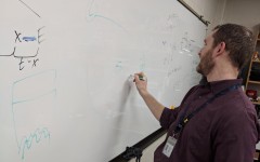 Ian Spangenberg draws diagrams to help explain how meteor showers happen.
