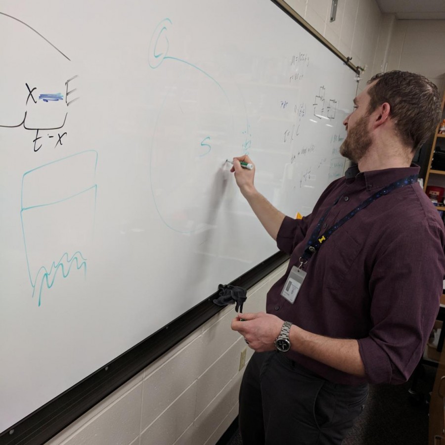 Ian+Spangenberg+draws+diagrams+to+help+explain+how+meteor+showers+happen.%0A