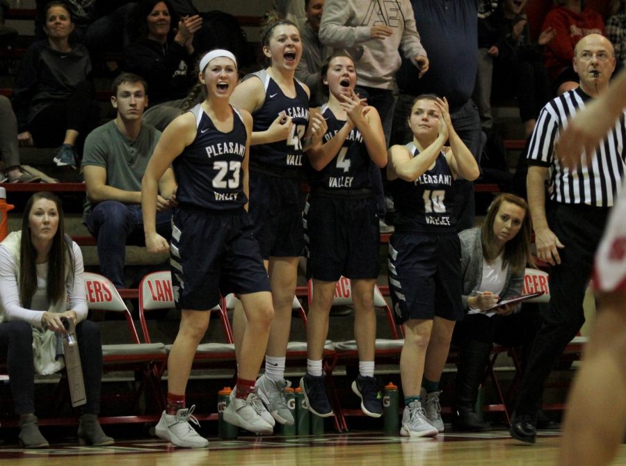 Varsity+girls+basketball+players+Macy+Beinborn%2C+Riley+Vice%2C+Regan+Denny%2C+and+Julia+Hillman+are+hopeful+for+a+PV+victory+while+cheering+on+their+teammate%2C+Carli+Spelhaug%2C+who+scores+two+points+for+the+Spartans.