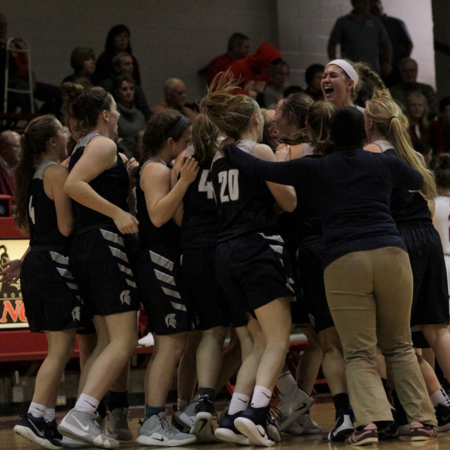 The+Pleasant+Valley+Girls+basketball+team+celebrates+their+victory+against+the+2nd+ranked+North+Scott+Lancers.%0A
