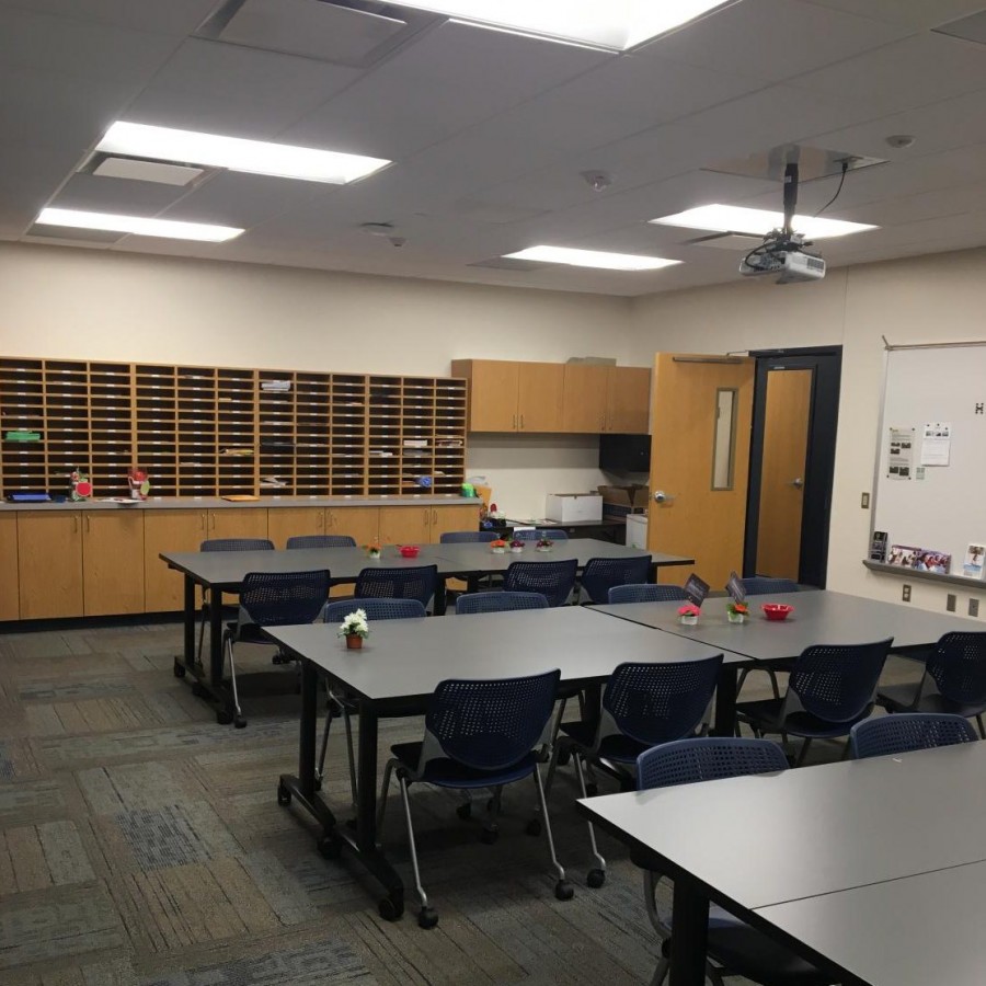 The teachers lounge is filled with movable tables and chairs so the room can be rearranged easily. 
