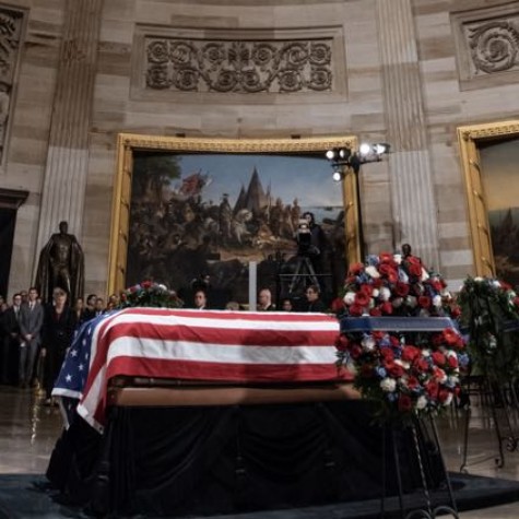 Americans say goodbye to George H.W. Bush for one last time.