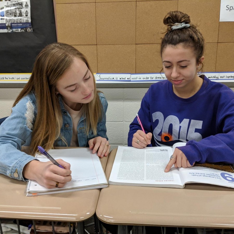 Seniors Christy Bishop and Azariah Courtney help each other study for an upcoming test.