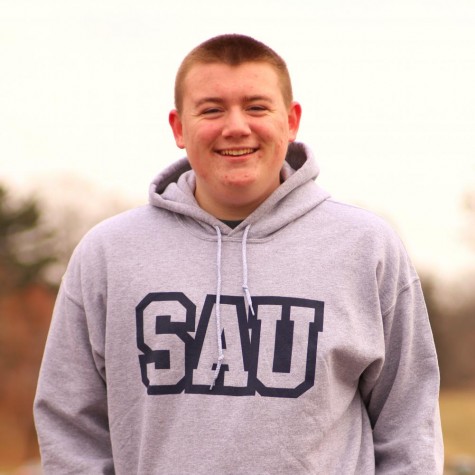 A senior photo of Alton Barber wearing a St. Ambrose sweatshirt which is where he is attending next year.
