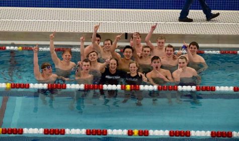 The PV varsity boys swim team team celebrated winning the district title with 411.2 points by jumping into the water with their coaches, Stacey Zapolski and Caitlin Schoville, on Feb. 2 at the Davenport Central pool.  

