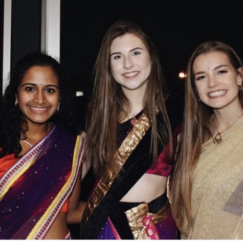 Students Amulya Pilutila, Elise Johnson, and Katie Gropel enjoying Diwali