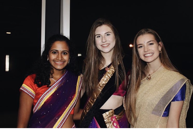 Students Amulya Pilutila, Elise Johnson, and Katie Gropel enjoying Diwali