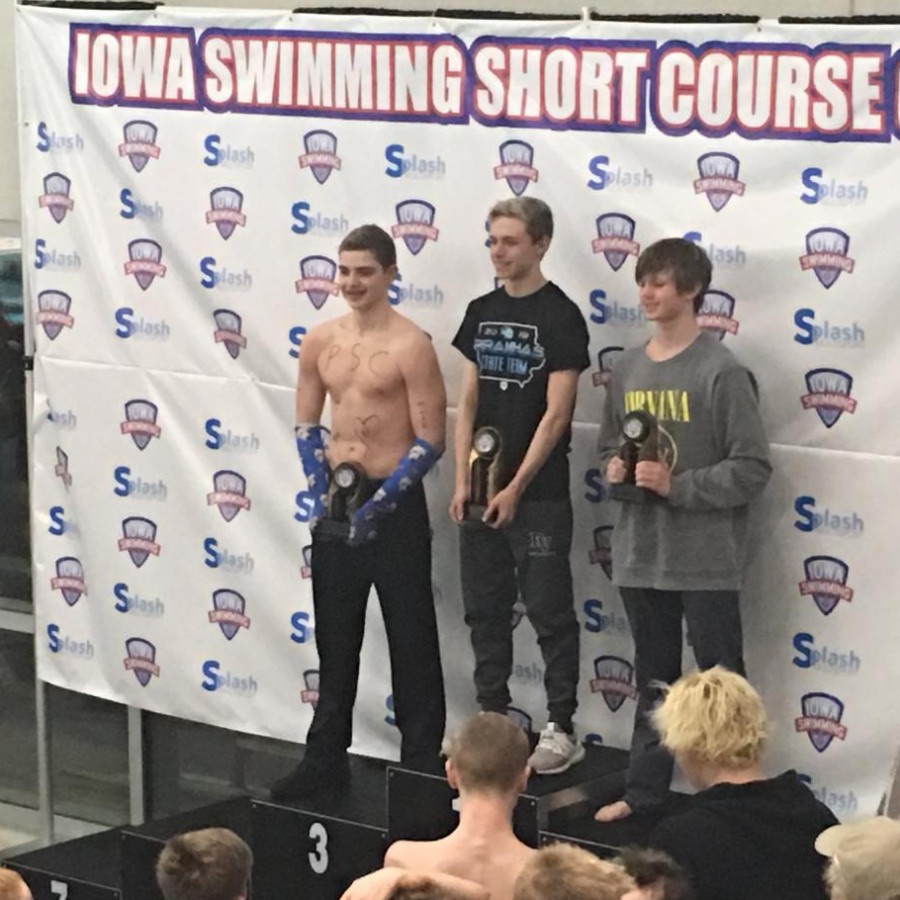 Second runner-up Jack Williams on the left and First Place Parker Paulson in the middle take the podium to accept their awards. 