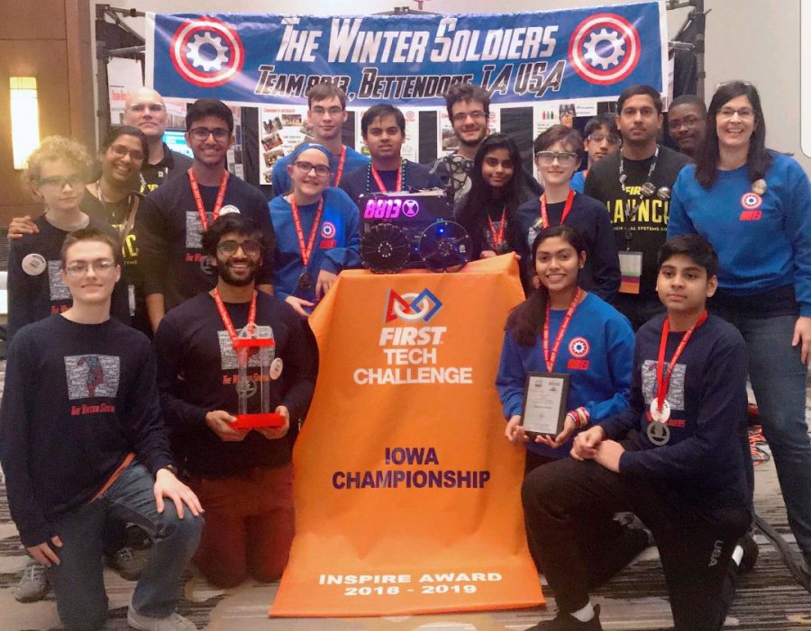 Photo of the Winter Soldiers holding the inspire award banner at the First Tech Challenge. 