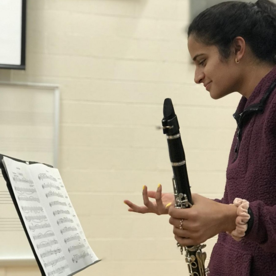 Junior clarinet player Amulya Pillutla looks at her solo in confusion after having such little time to rehearse it. 