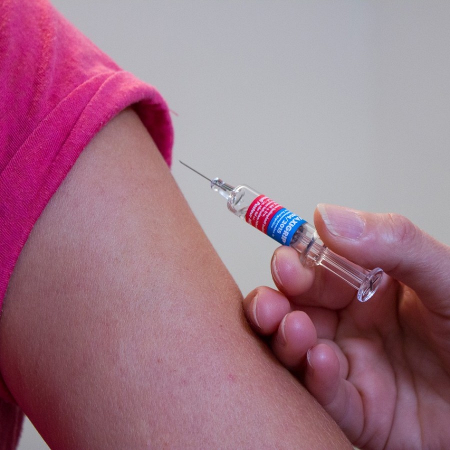  A vaccination, similar to those students receive, is administered by a nurse.