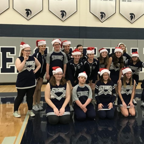 The Shining Stars dance team are all smiles after performing a dance during halftime of the jv boys basketball game. 
