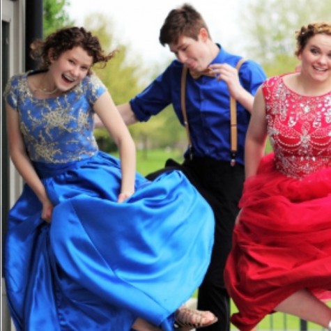 Stuent Emily Johnson jumps for joy in the prom dress she made