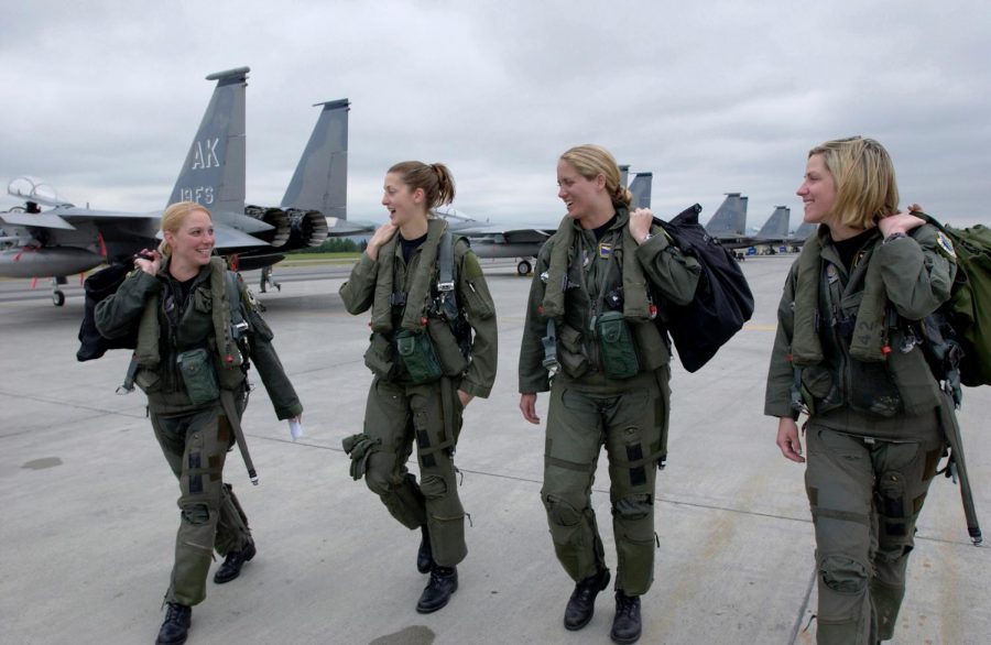 Four women, F-15 Eagle pilots walk to their jets at Elmendorf Air Force Base, Alaska. 
