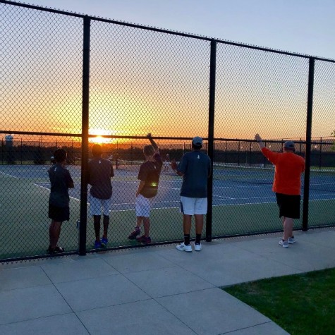 Players at the West Des Moines Valley vs. Pleasant Valley tennis meet on Monday, May 7 waiting for the meet to finish before a three hour drive home.