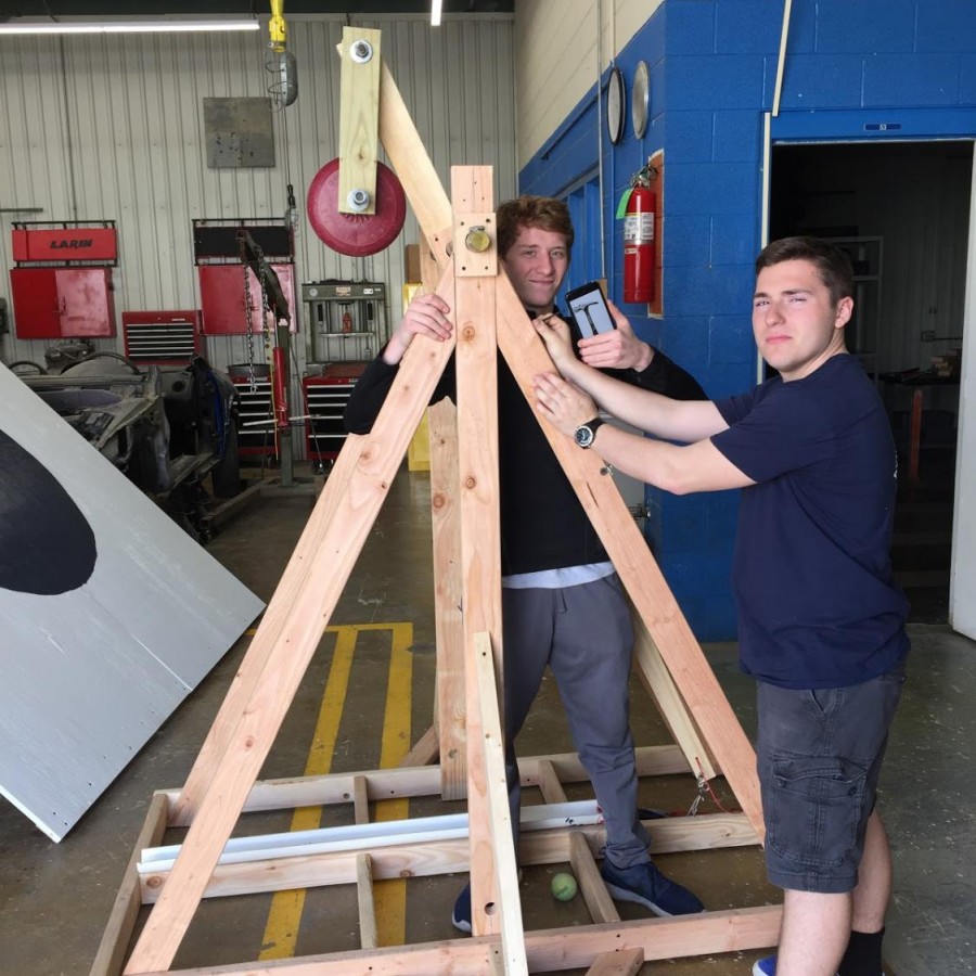 Pictured is Weisbeck and Dahm, in the early stages of building their final catapult design.