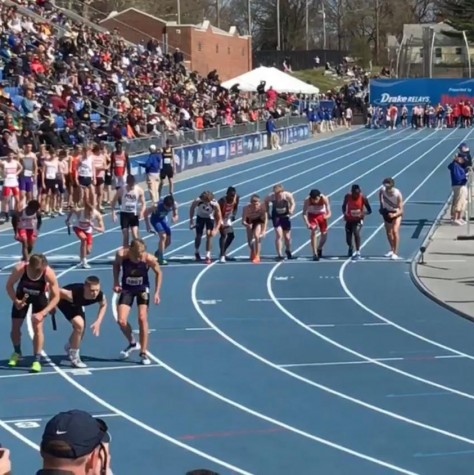 High school athletes line up for the 4x800 meter relay during the 2018 Drake Relays.