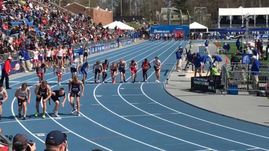 High school athletes line up for the 4x800 meter relay during the 2018 Drake Relays.