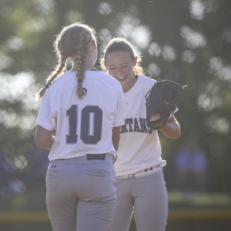 Ellie and Carli Spelhaug celebrate together after a conference play win in June of 2018. The two athletes went on to lead their team in becoming back-to-back state champions.  