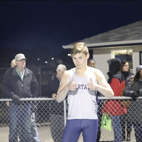 Junior Ben Wilson poses for the camera before his race at the Spartan Invitational on March 28.