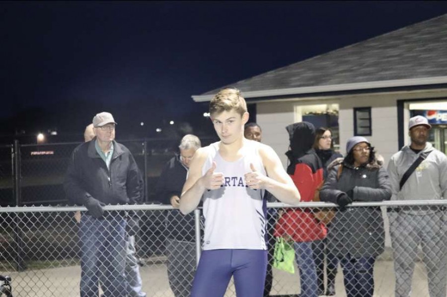 Junior Ben Wilson poses for the camera before his race at the Spartan Invitational on March 28.