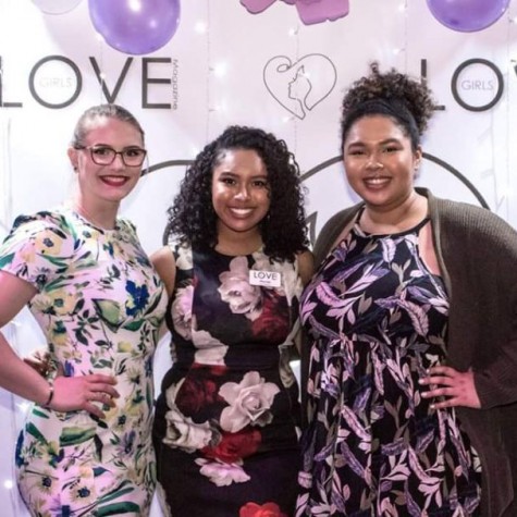 Senior Mariah Martinez, middle, poses with Hannah Olka, and her sister, PV alumna TaKera Martinez, right, on the Love Award’s “purple carpet.”