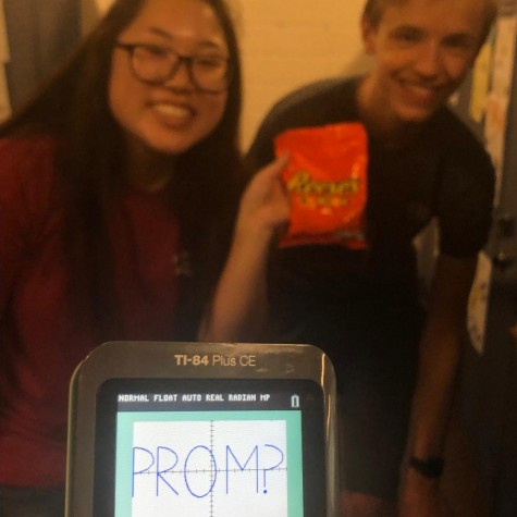 Margaret Huang (left) promposes to Owen Jones (right) using her TI-84 calculator.