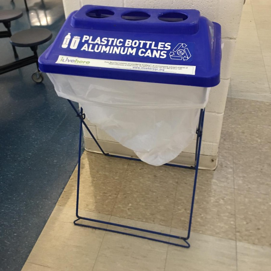 Recycling bins in the lunchroom are emptied into large containers outside and sent to the landfill across the Mississippi river.  