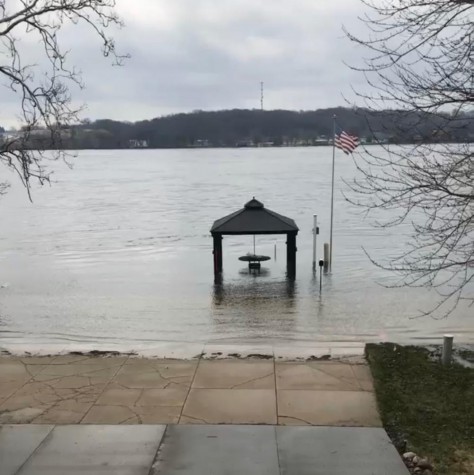 Mississippi River covers the road and driveway, preventing senior Ada Duncan from getting to school.