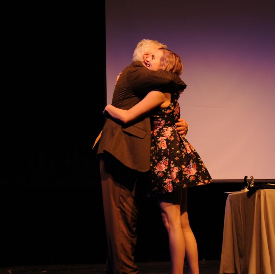 Freshmen, Harper Clark, hugging Director Bill Myatt after being inducted into the Thespian Honor Society.
