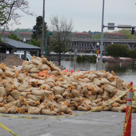 A pile of sandbags sits ready to combat the flooded streets of Davenport.