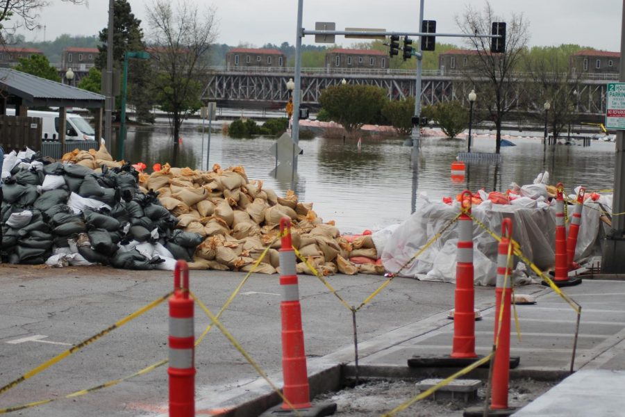 Volunteers packed thousands of sandbags and worked to fortify the temporary barrier built to contain the floodwater