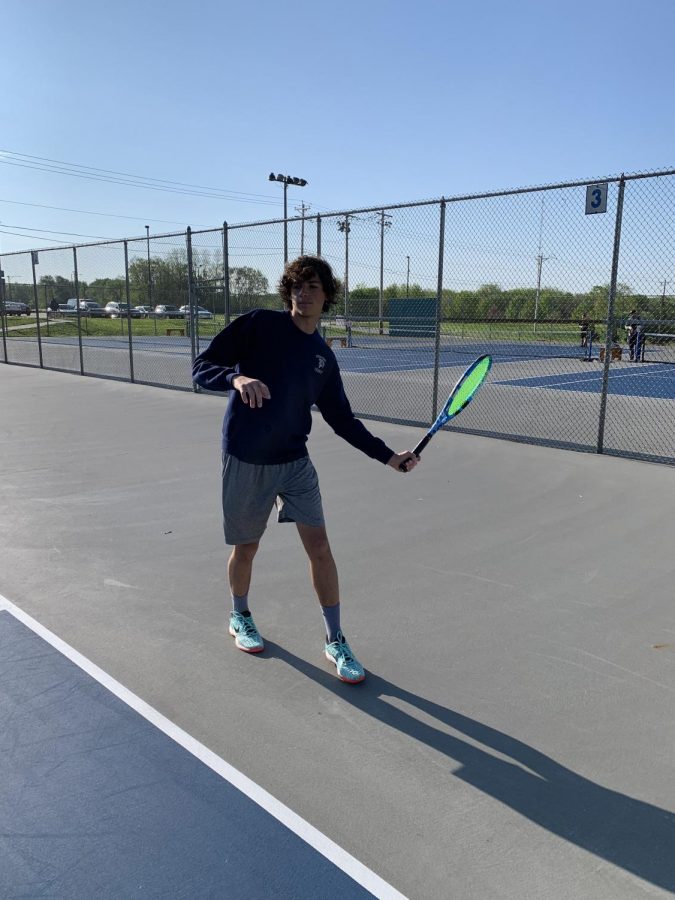 Freshman Mazen Alsheika loads up to hit a forehand.