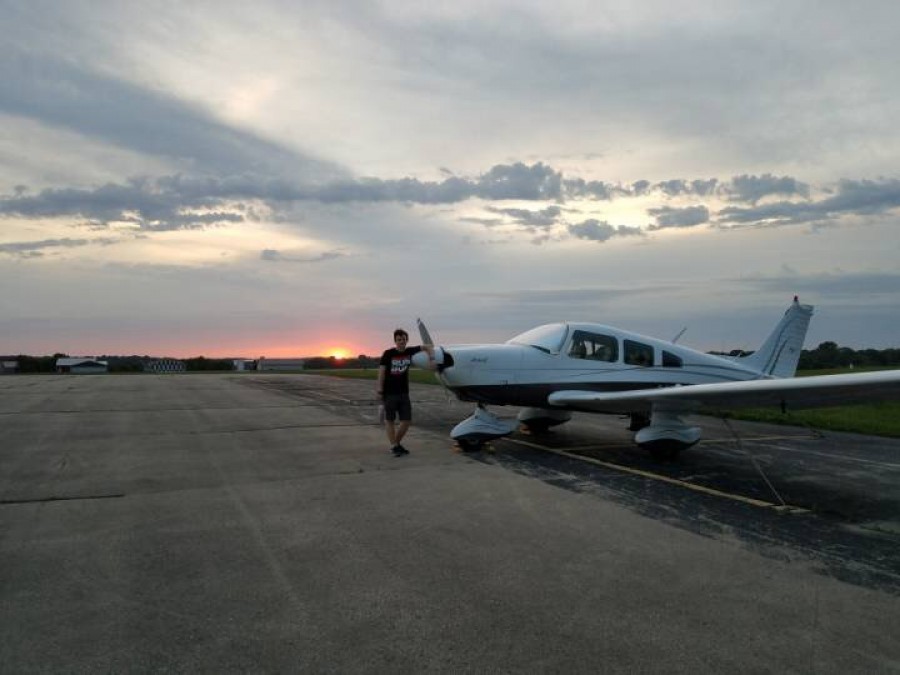 Rian OHanlon poses next to a Piper Archer II, the aircraft he plans to fly over the summer.