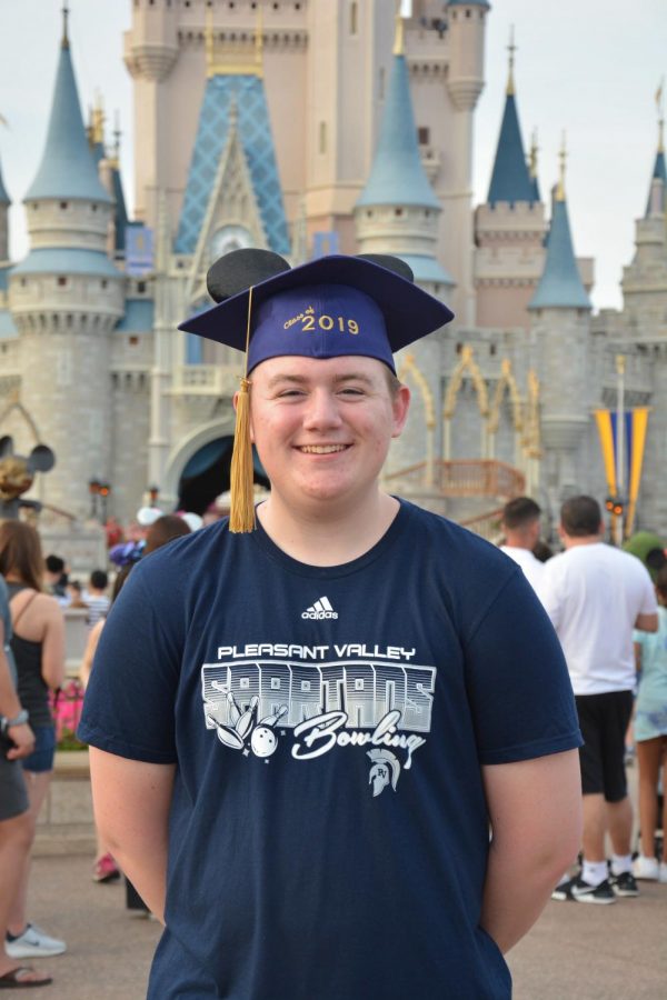 Alton Barber poses in front of the famous Cinderella Castle at Disney World