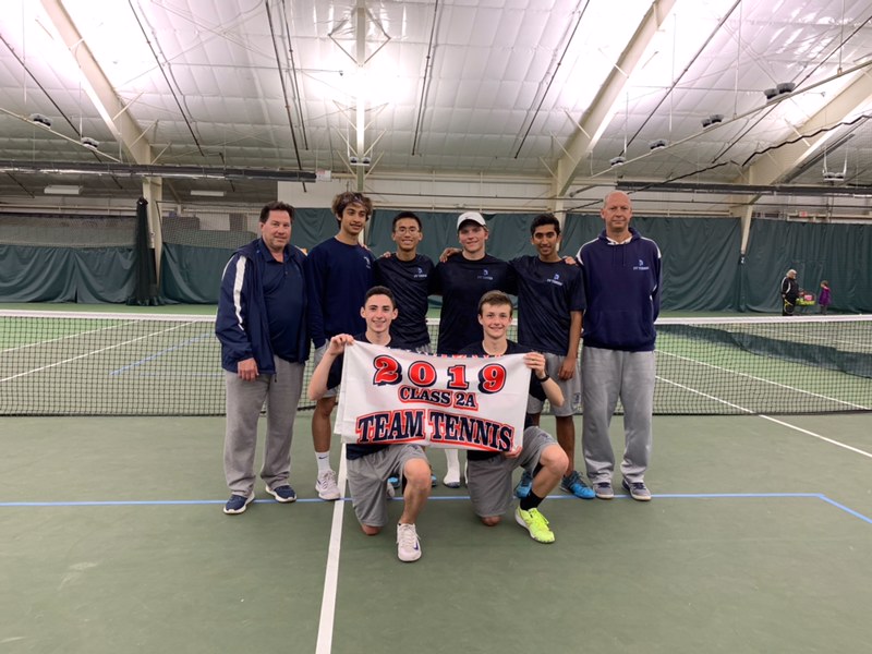 The+boys+tennis+team+is+all+smiles+after+becoming+a+state+qualifier.